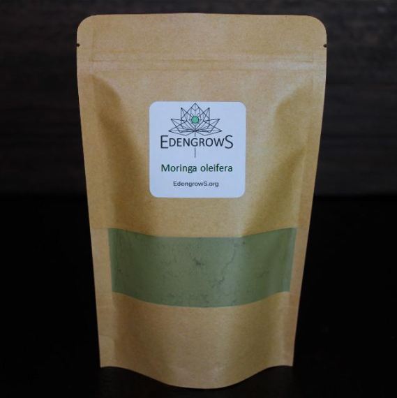 Finely grounded moringa powder in a sealed bag for shipping